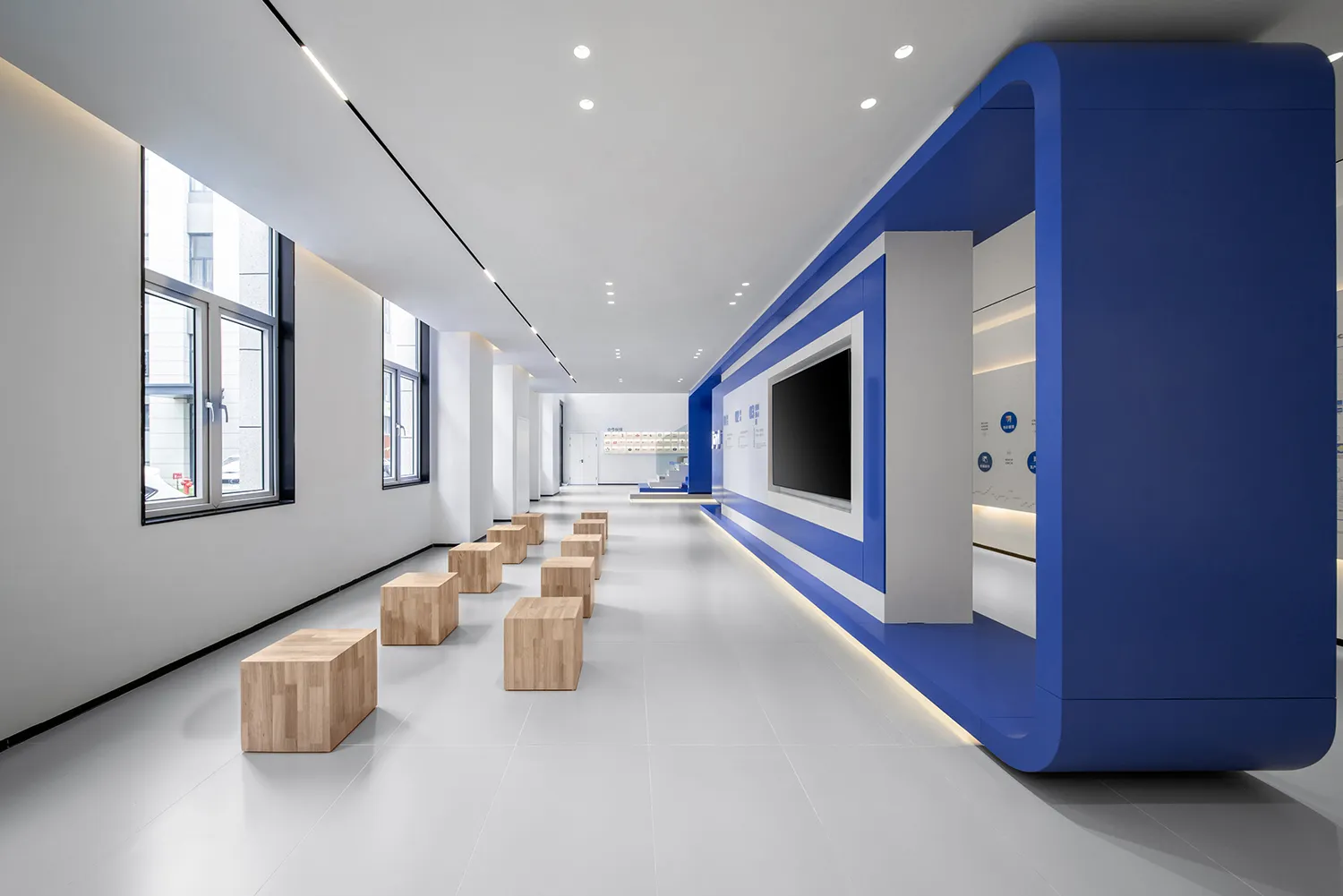 A modern office space featuring blue and white design elements.