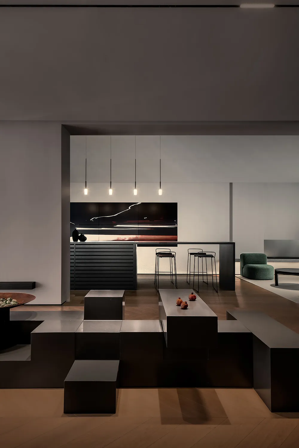 A minimalist living room featuring black metallic furniture and a large abstract painting.
