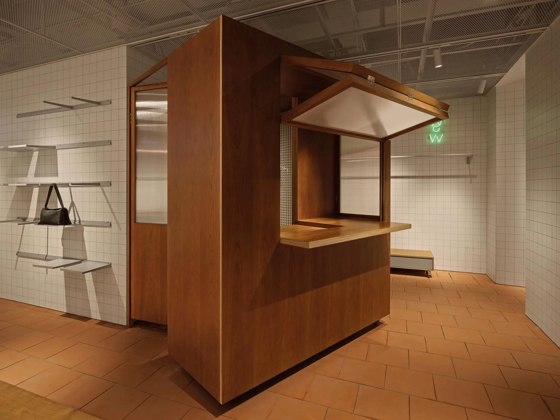Modern retail store with a wooden counter and minimalist design.