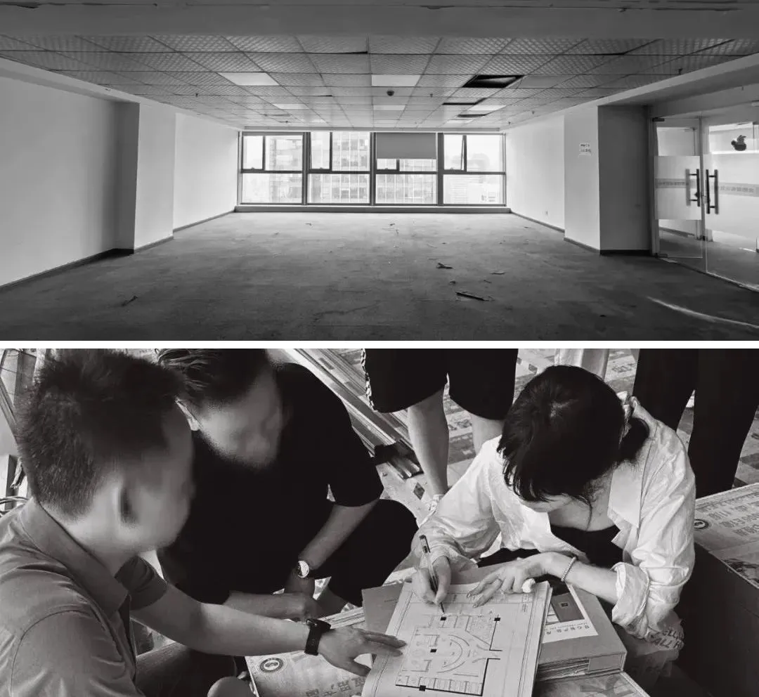 A black and white photograph showcasing the interior of a renovated office space with a concrete floor.