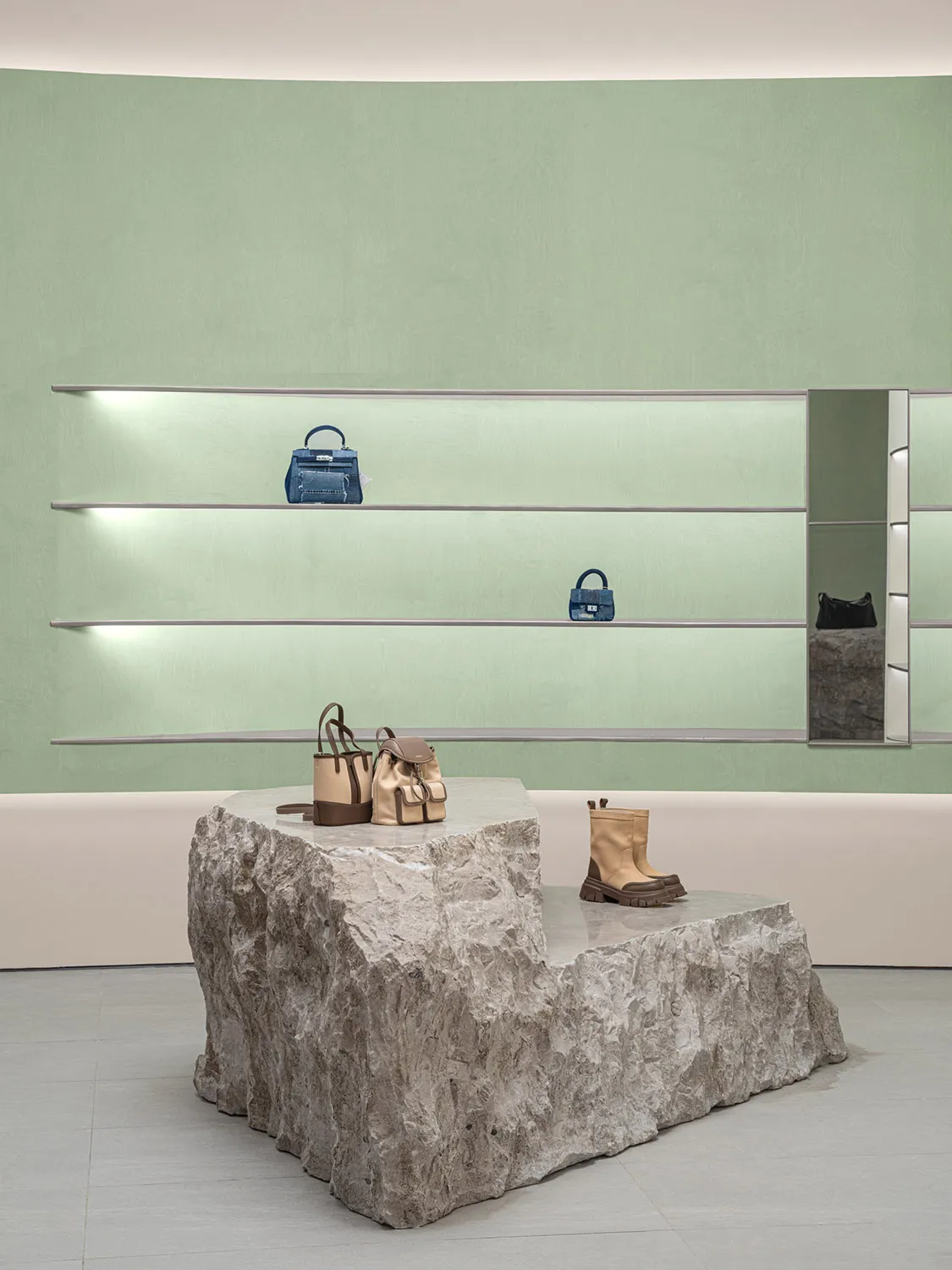 A retail storefront with a concrete base and minimalist design.