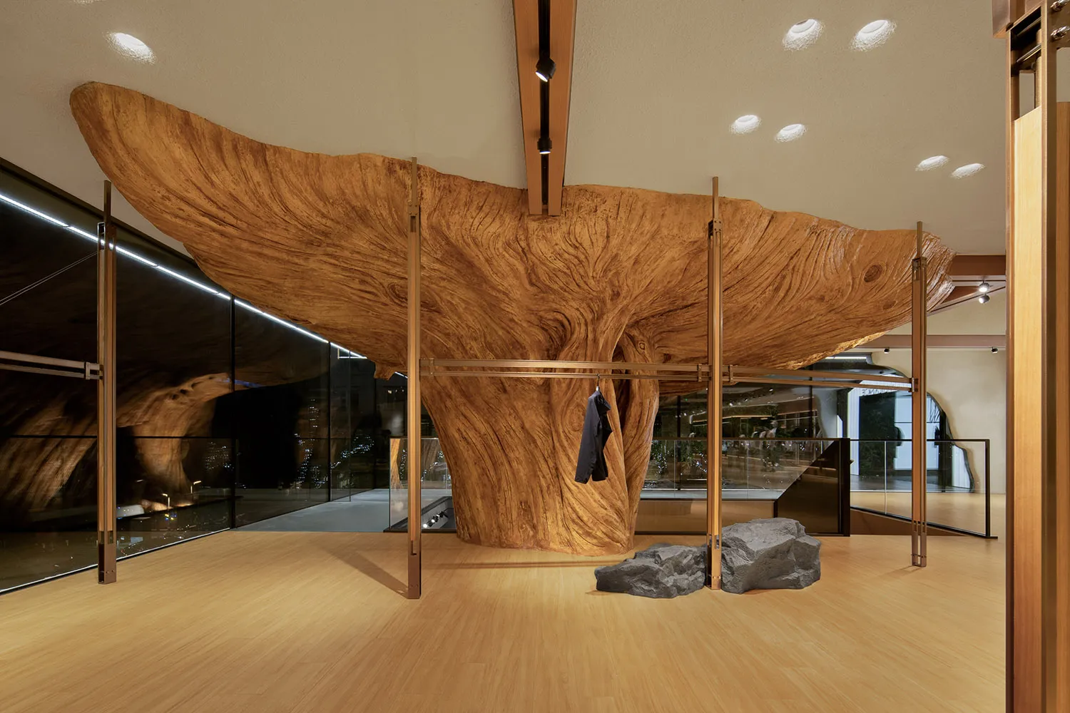 A modern art deco interior featuring a large wooden sculpture as a central focal point.
