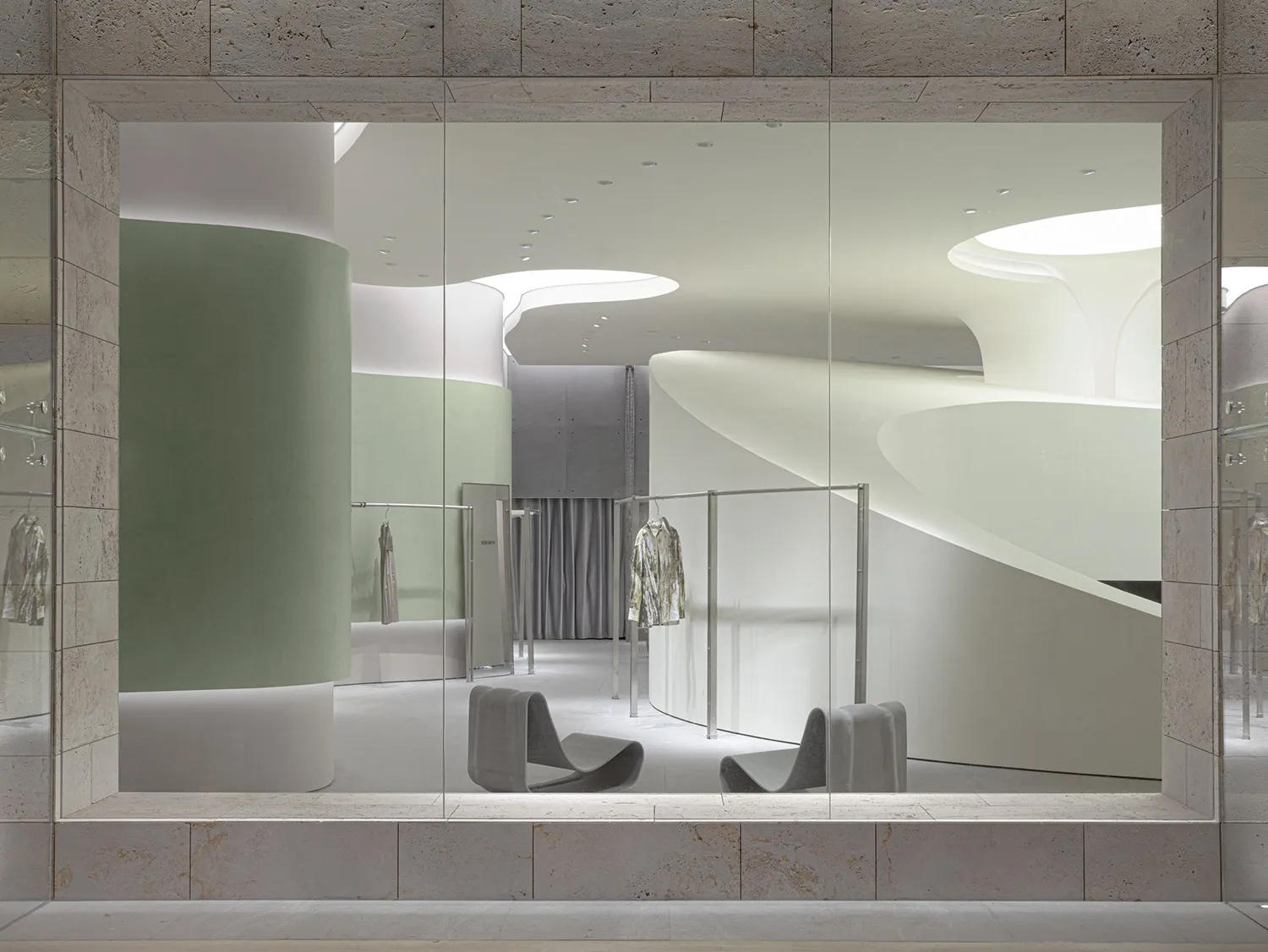 Modern retail space featuring minimalist concrete and stone design