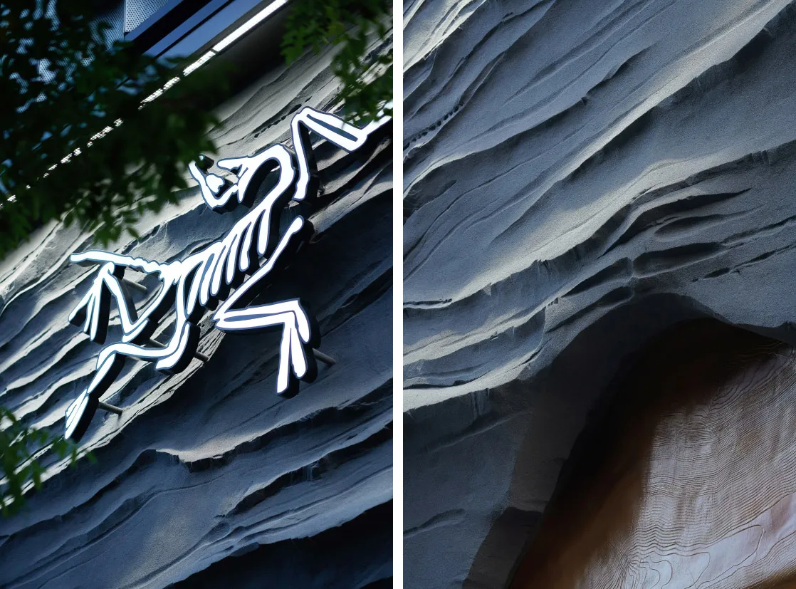 Close-up of a modern building's cement exterior featuring textured relief patterns.