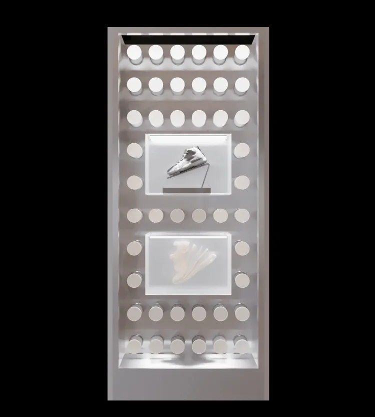 A metallic shoe shop display case with illuminated compartments and showcases.