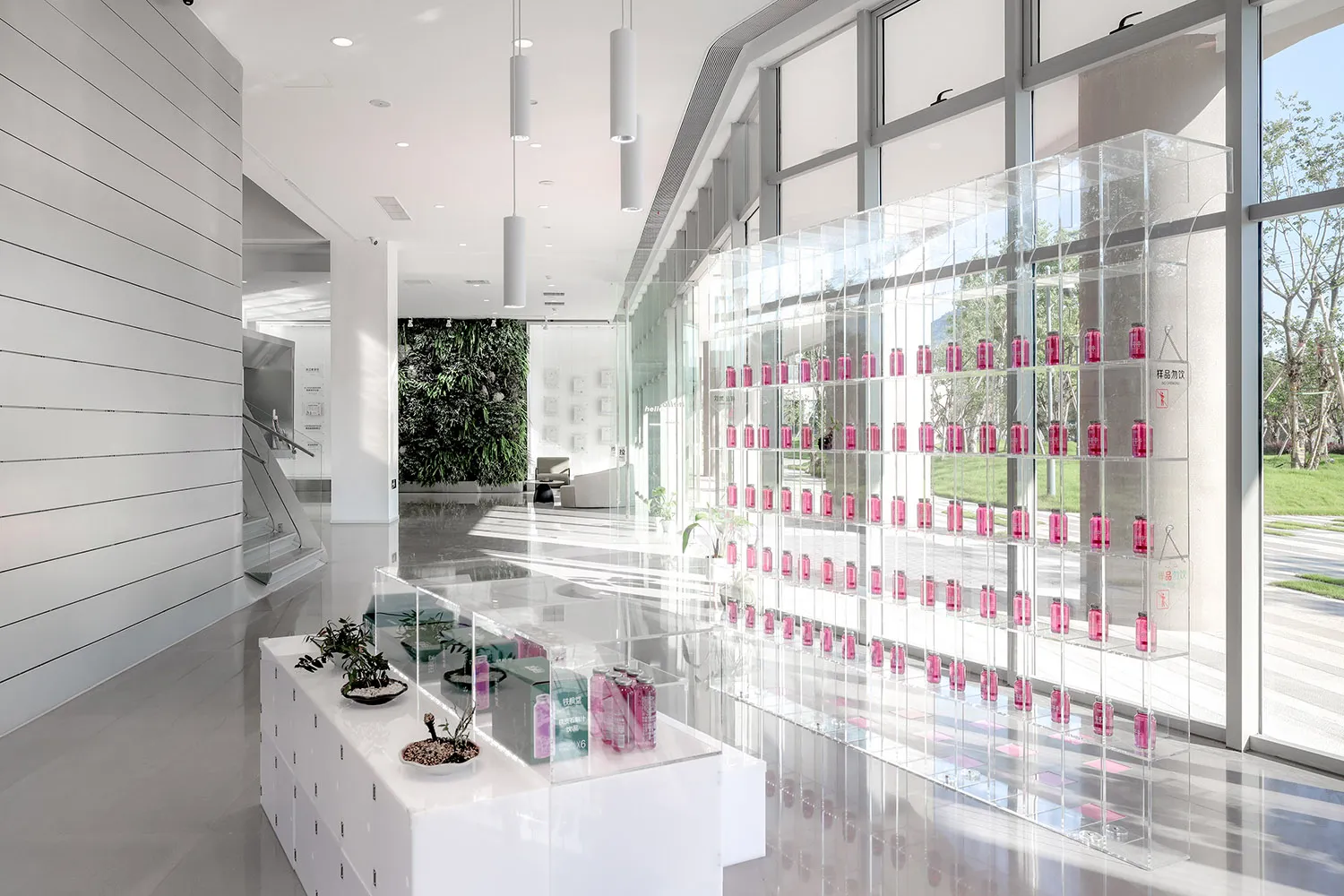 A modern, minimalist commercial interior with clear glass elements.