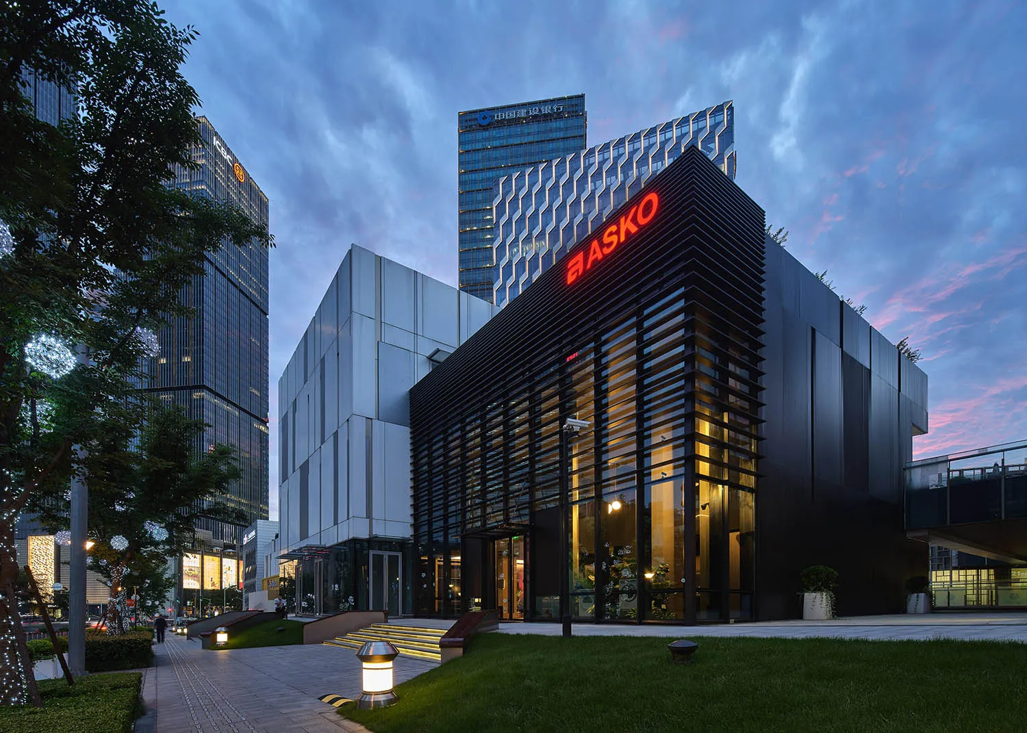 Modern office building exterior featuring metal cladding and glass.