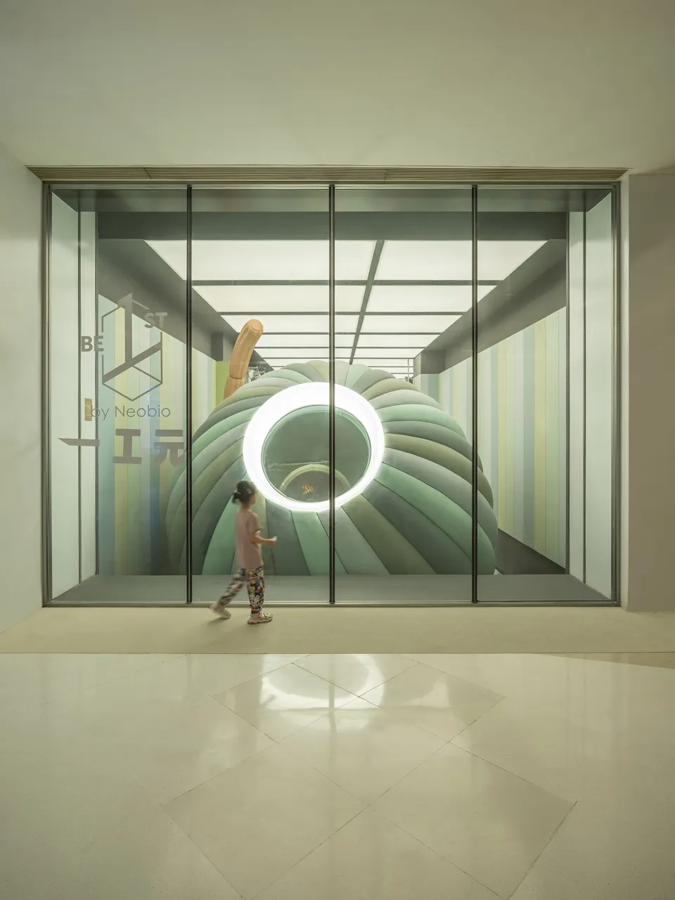 A modern interior space featuring glass elements