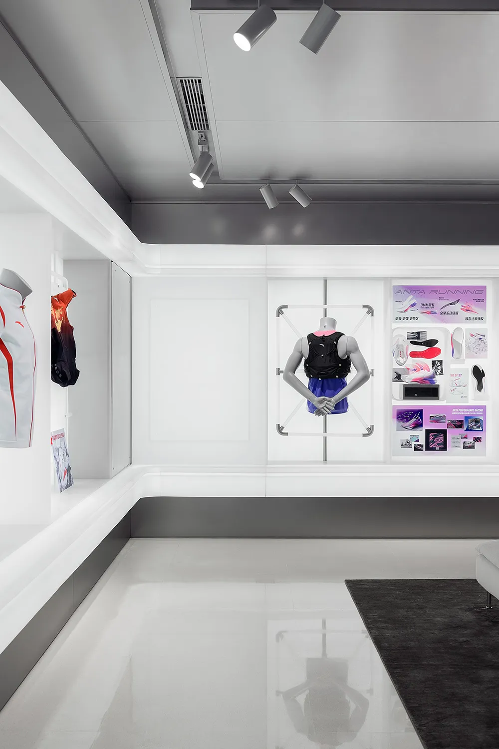 Modern retail space featuring white concrete floors, glass display cases, and minimalist design elements.