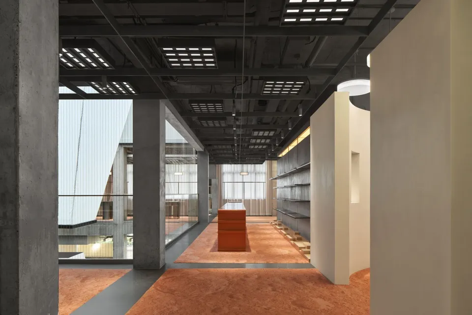 A modern retail space with a concrete interior design.
