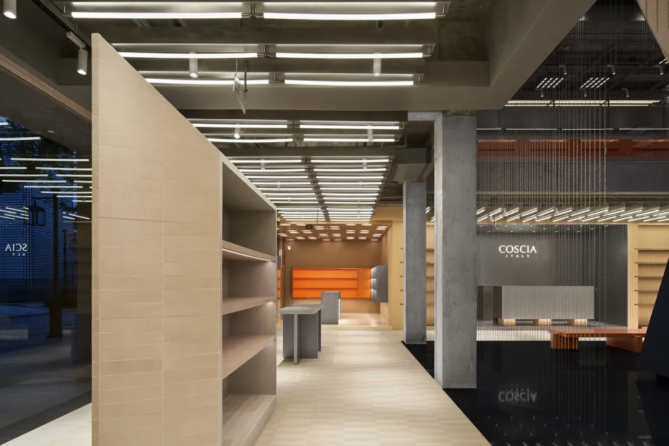 Modern retail storefront with a concrete exterior and minimalist design.