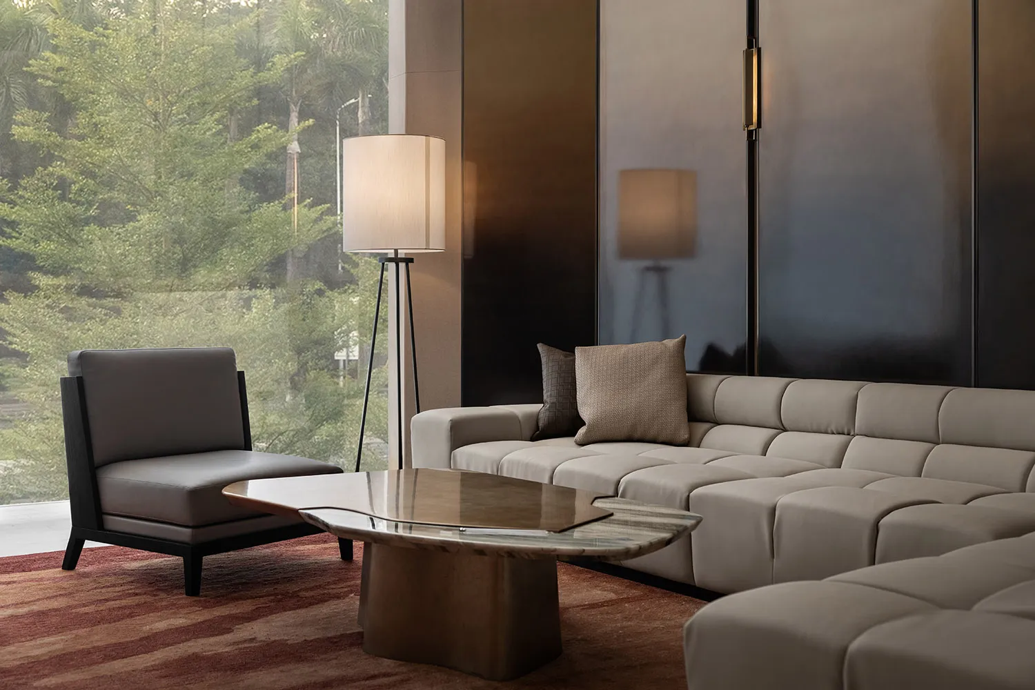A modern living room with leather sofas and a marble coffee table.
