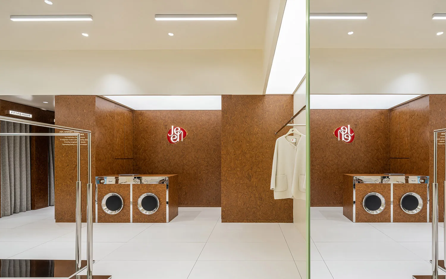 Modern retail interior with wooden clothing shop, featuring brown wooden walls and white floors.