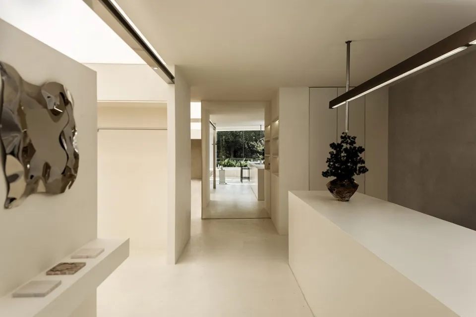 Modern minimalist interior with concrete elements, clean lines, and simplicity.
