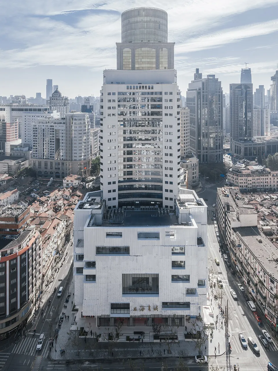 A high-rise building made of modern materials in an urban setting.