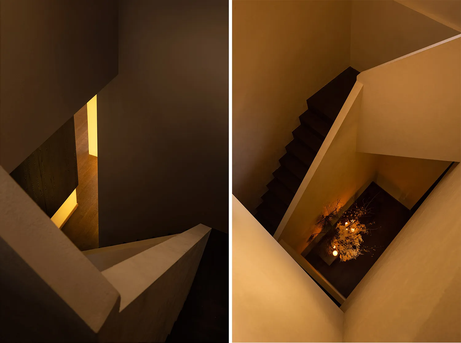 A modern staircase made of concrete with decorative lighting.