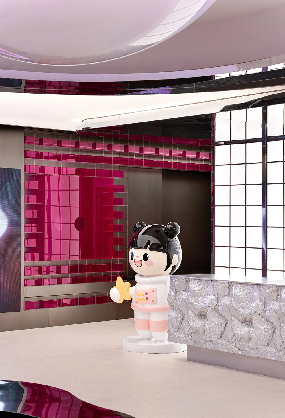 A modern interior design featuring a plastic character holding a star.