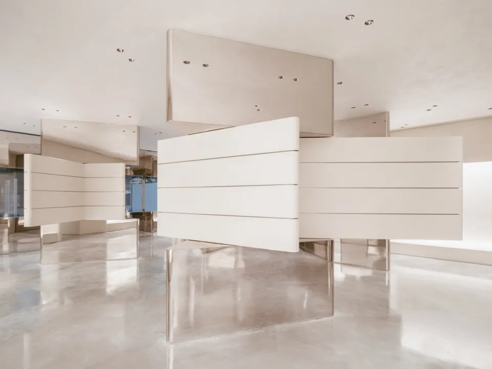 A minimalist, modern interior design featuring sleek, metallic panels.