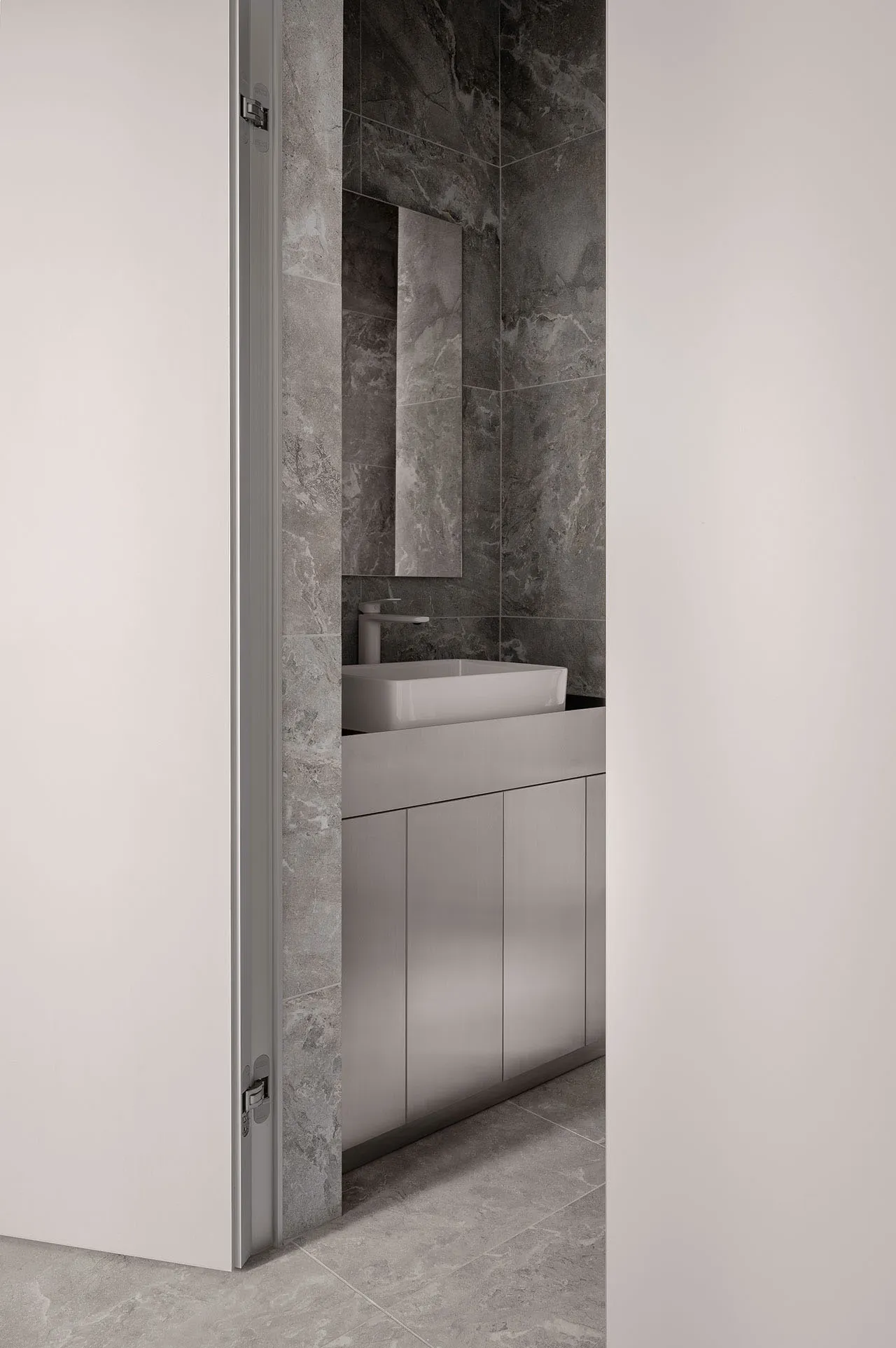 Minimalist bathroom with concrete tiles and a modern sink.