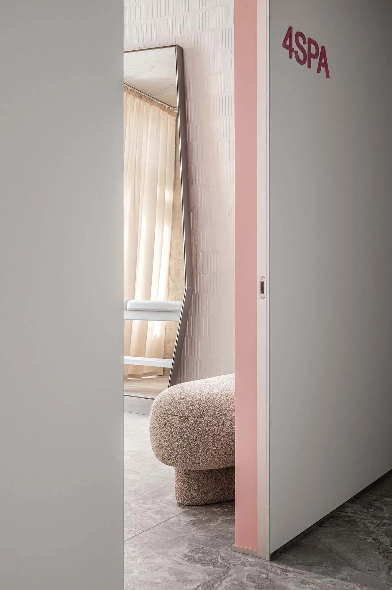 Spa interior with a textured upholstered seat and soft lighting