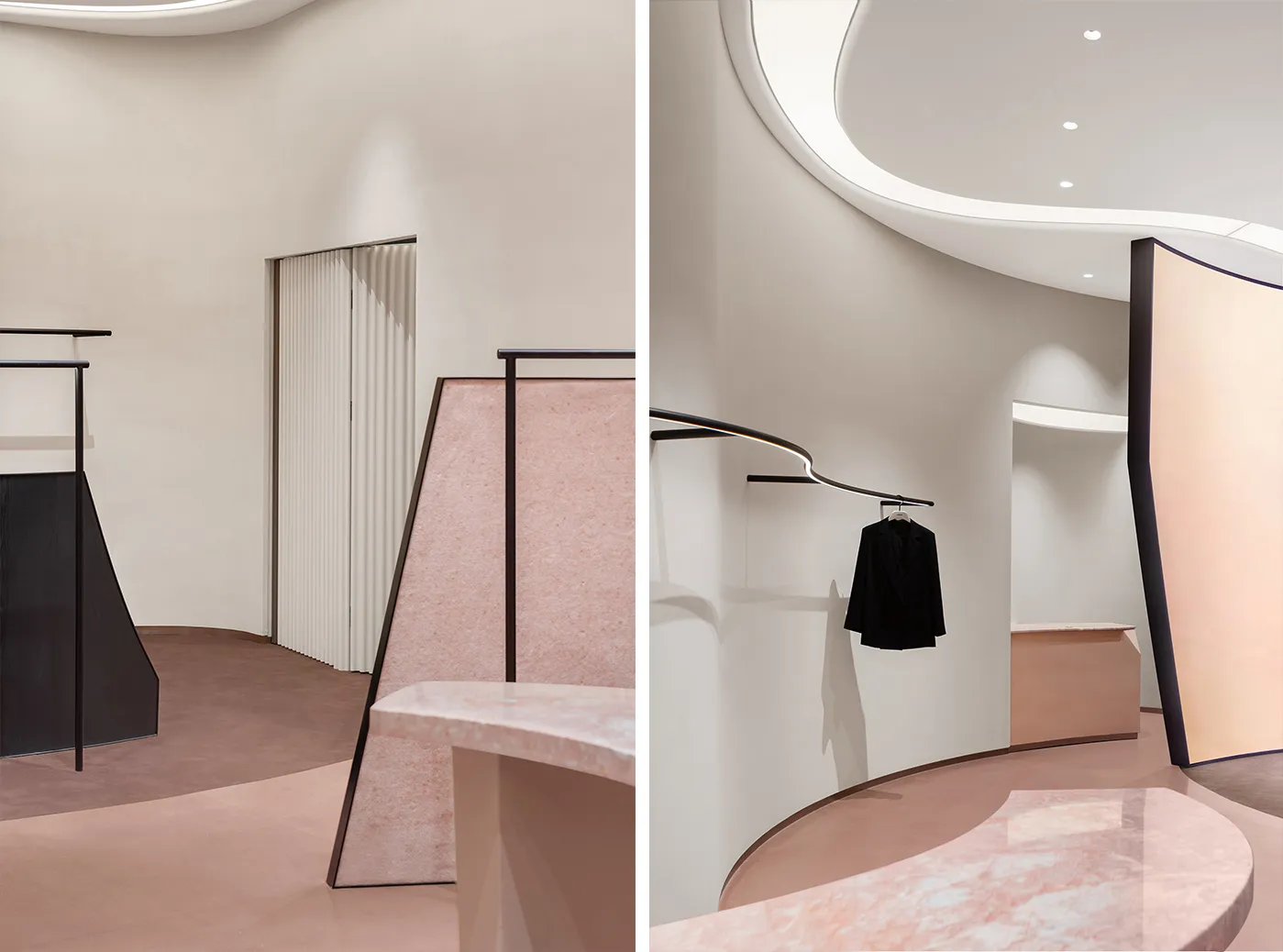 Minimalist retail space with marble surfaces and metal railings.