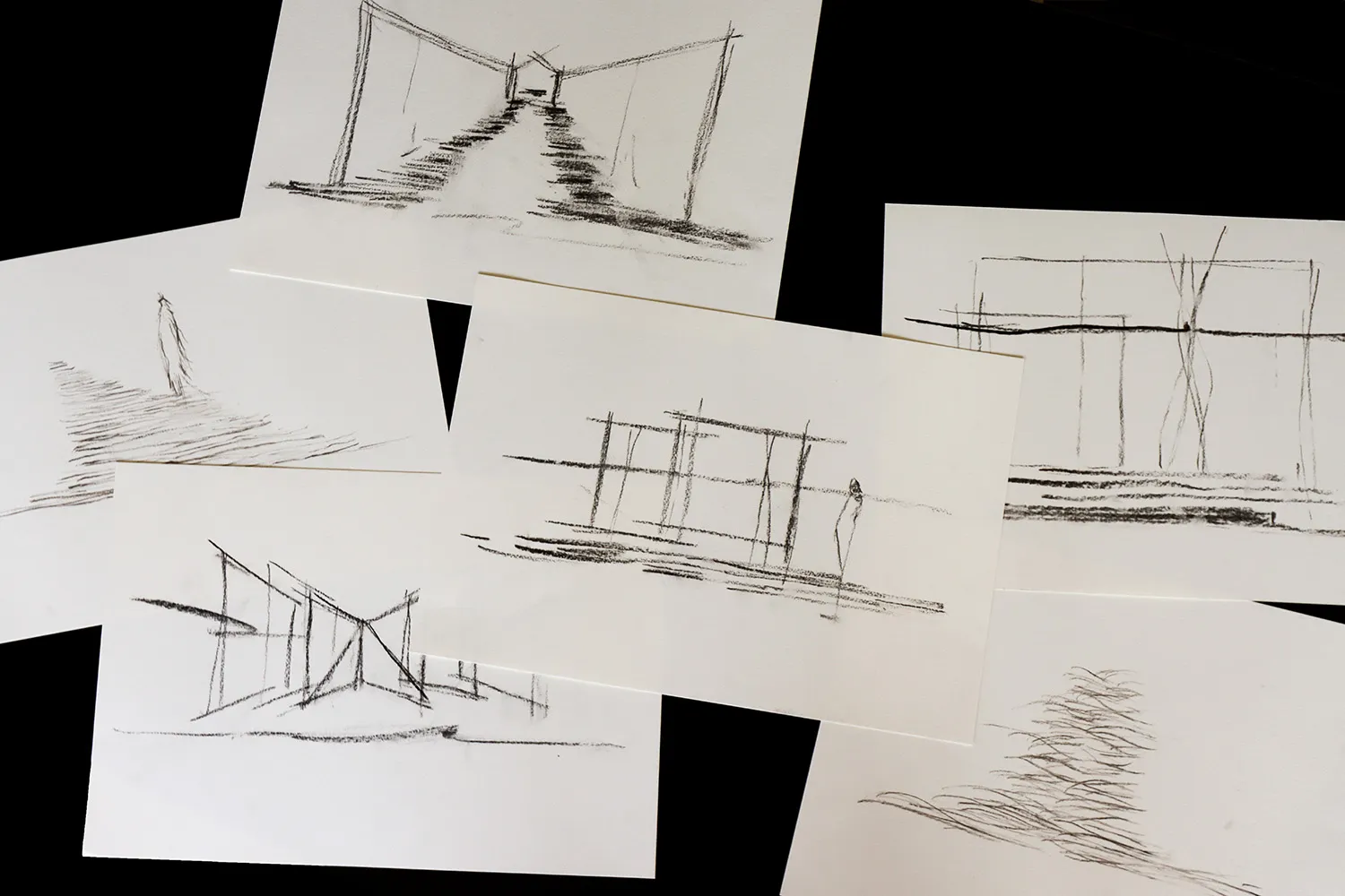 Various graphite sketches showcasing architectural and design elements.