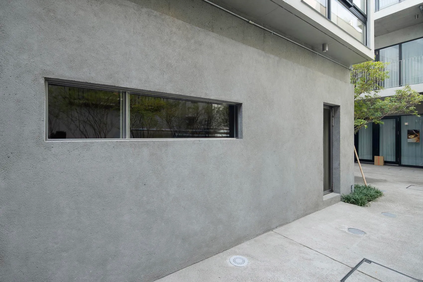 Modern building exterior with concrete walls and minimalist design.