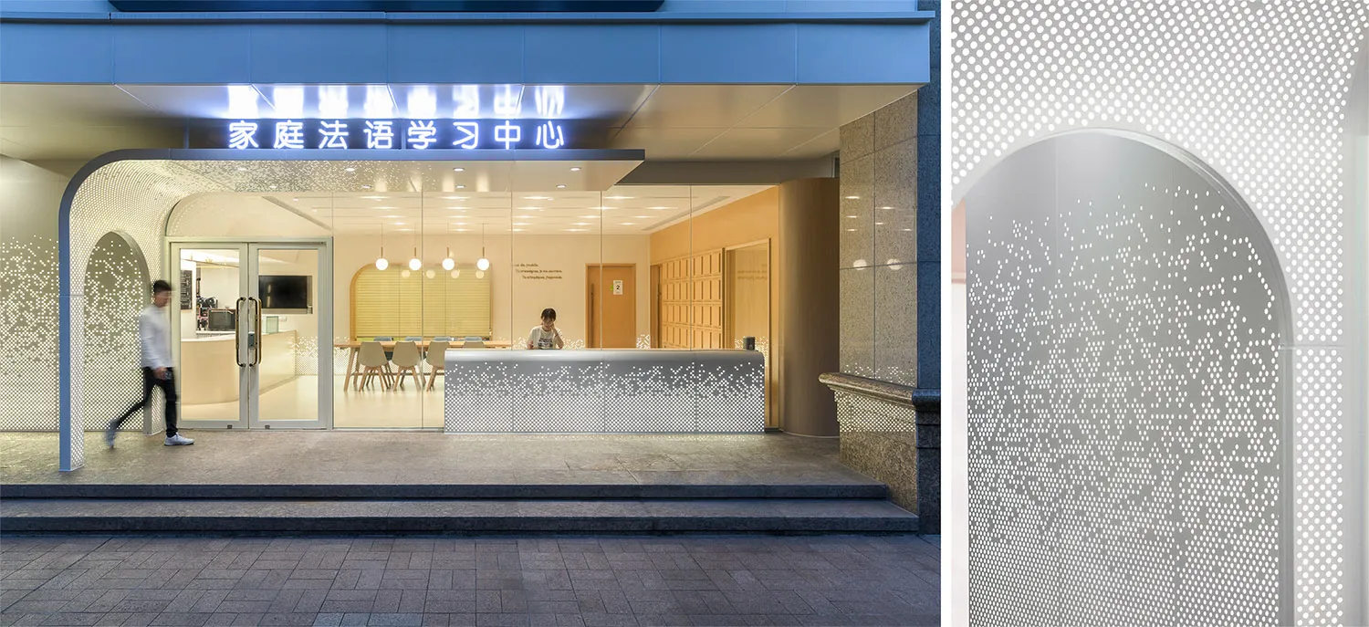 Modern commercial space featuring a concrete wall and floor, with industrial lighting and minimalist design.