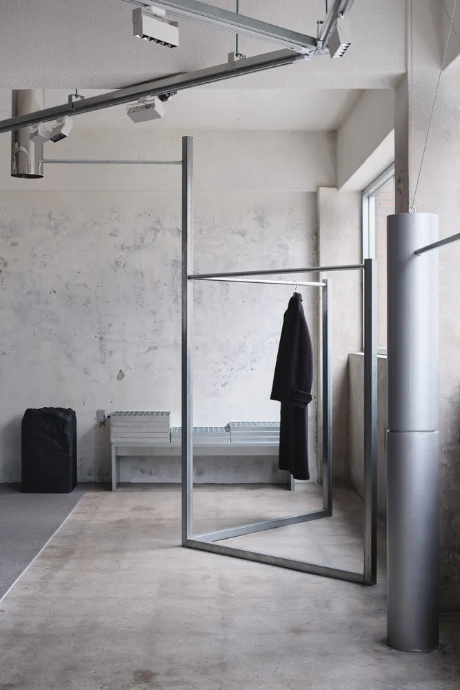 Modern industrial clothing store with minimalist design