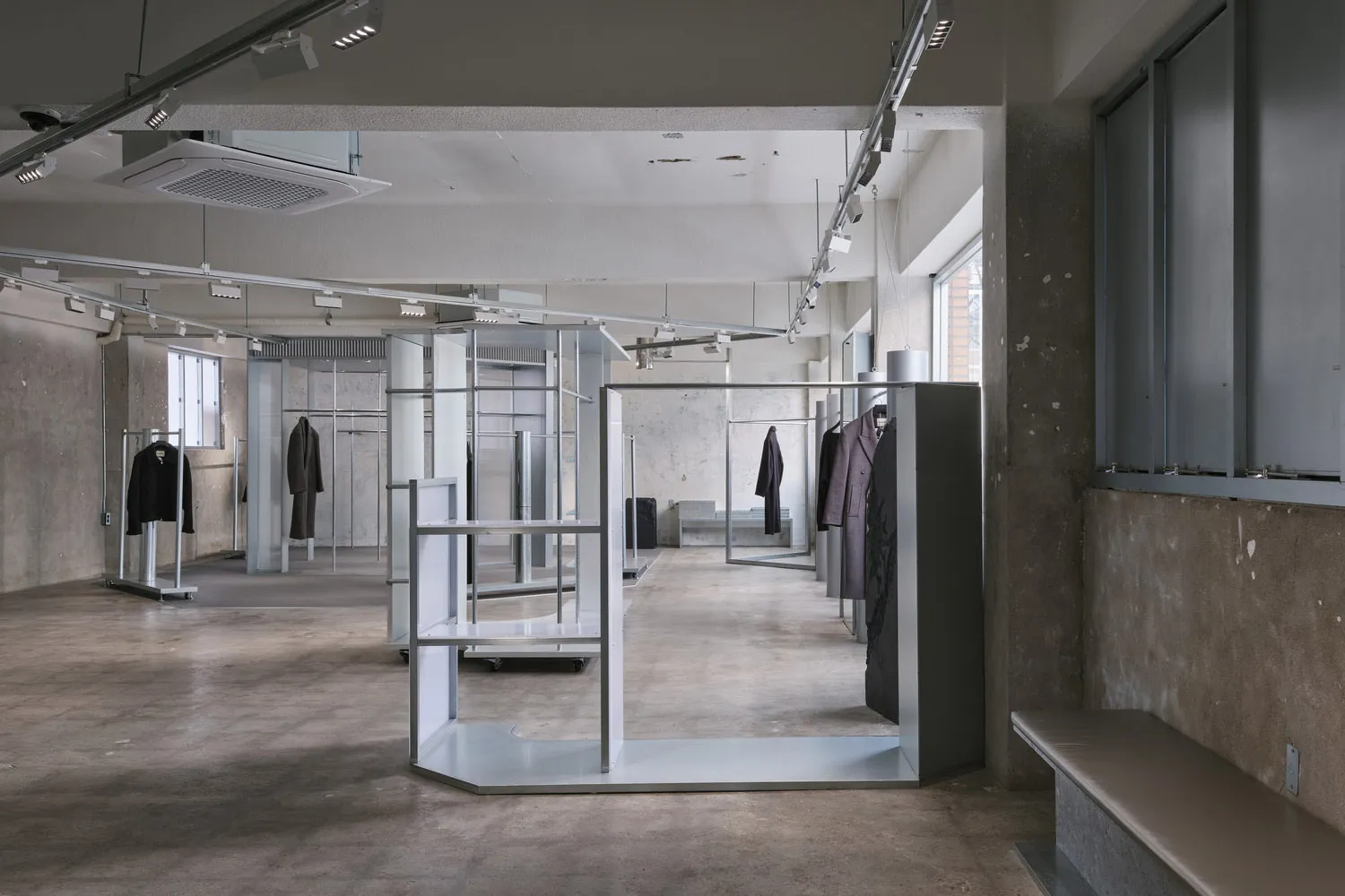 An industrial storefront with concrete walls and minimalist design.