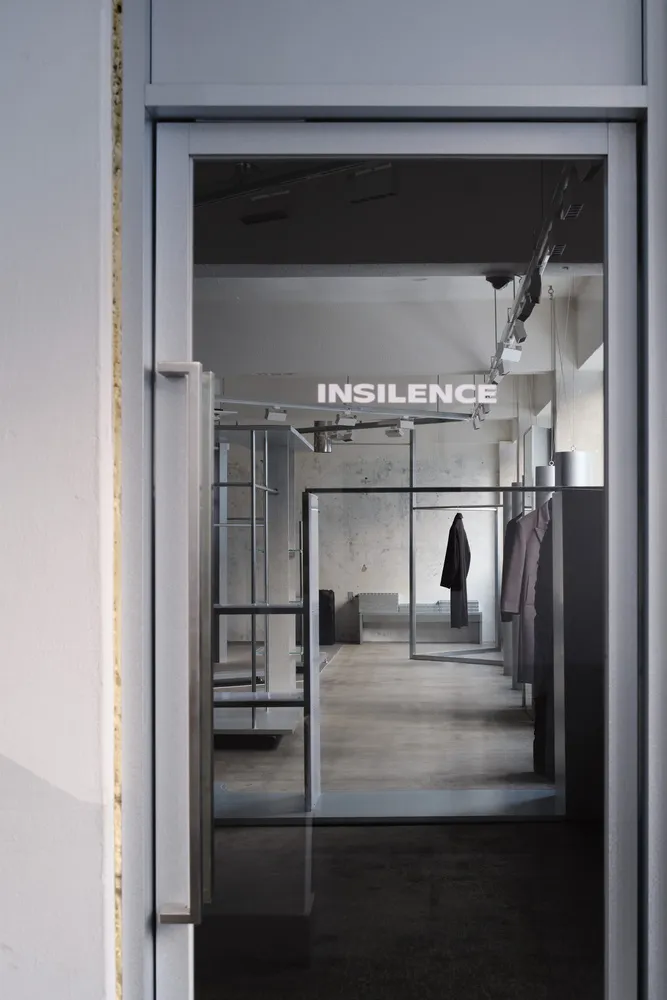 Modern clothing store with concrete minimalist interior design.