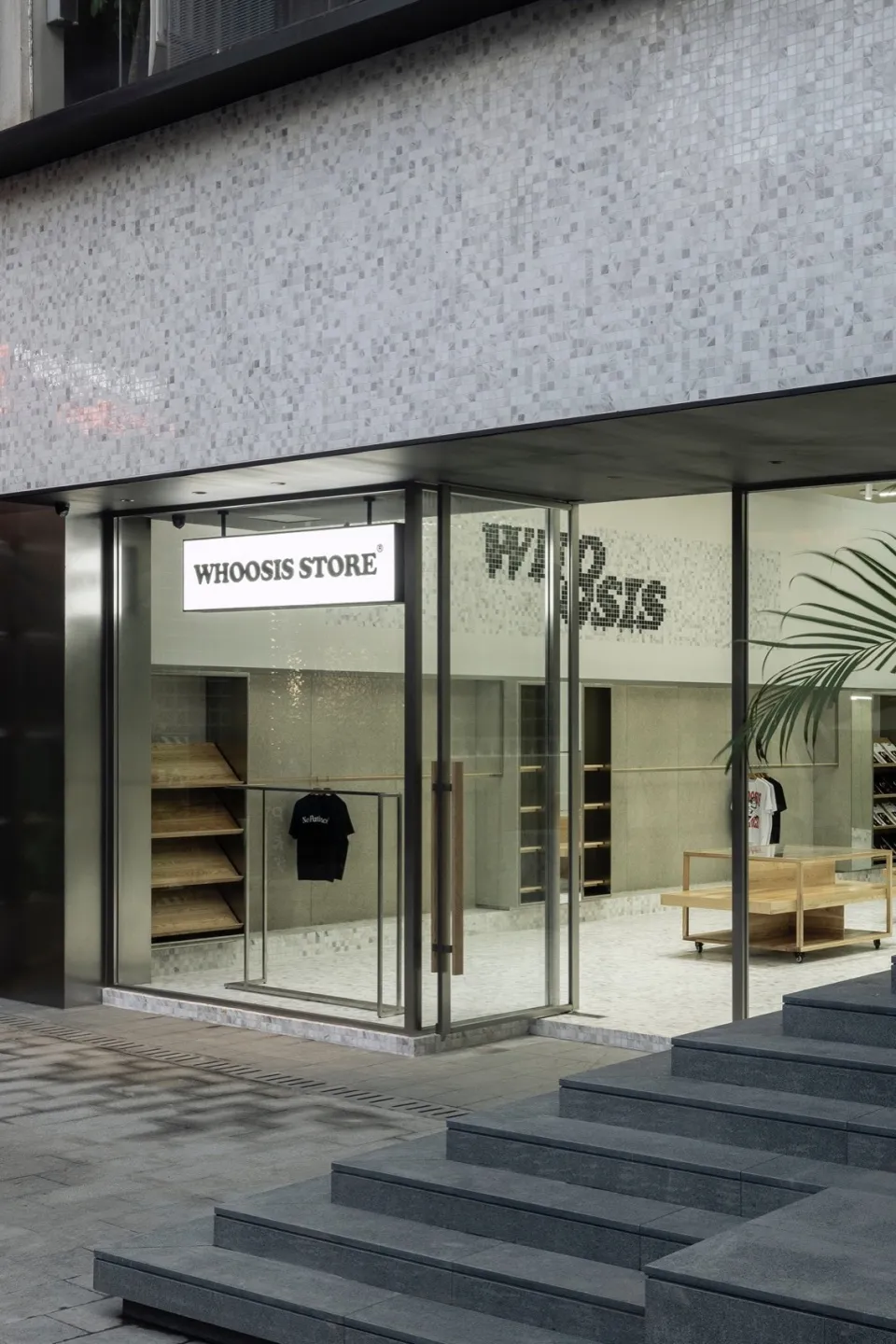 Modern retail storefront featuring glass storefront and interior with minimalist design.