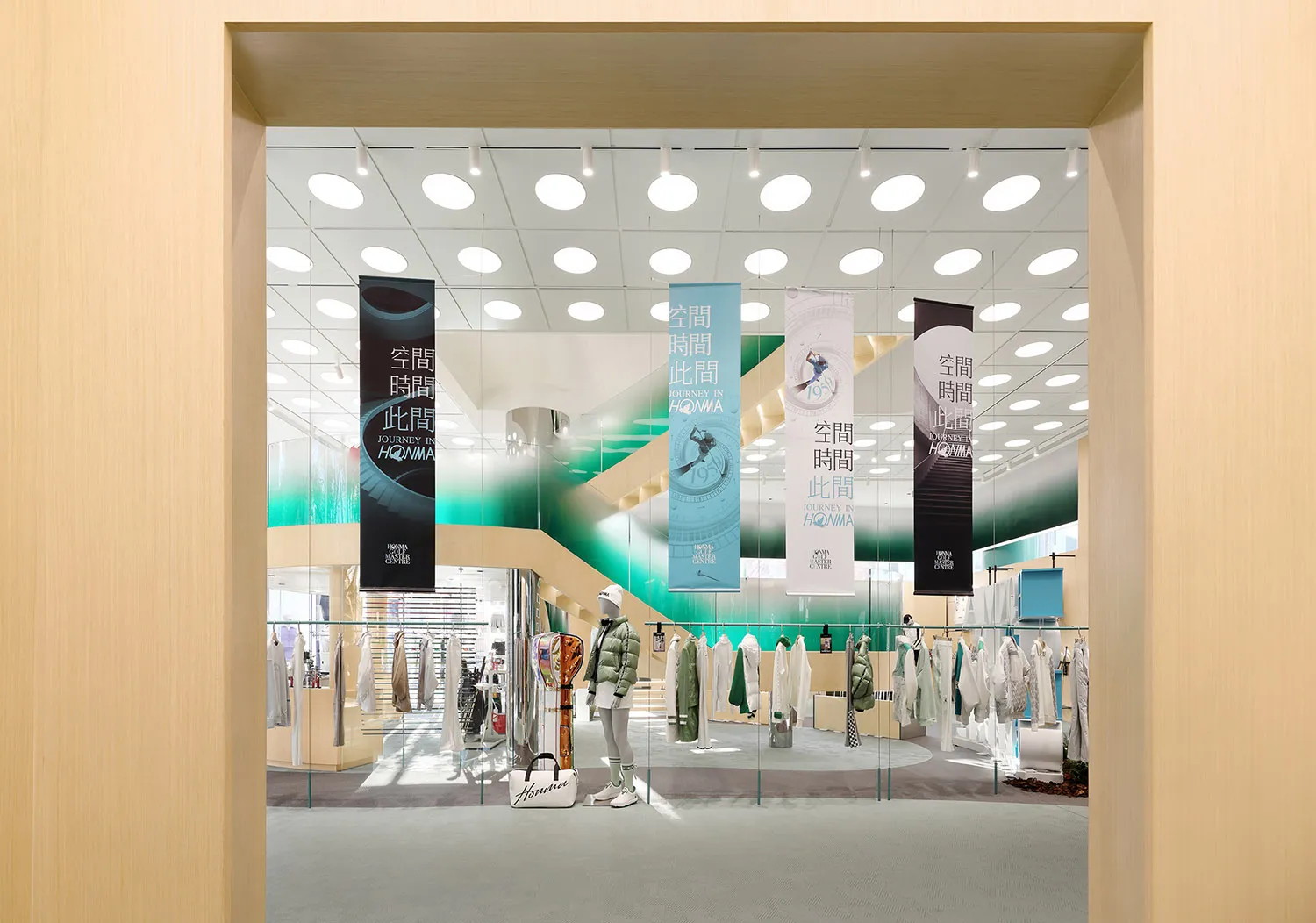 A modern retail storefront with glass walls and white interior.