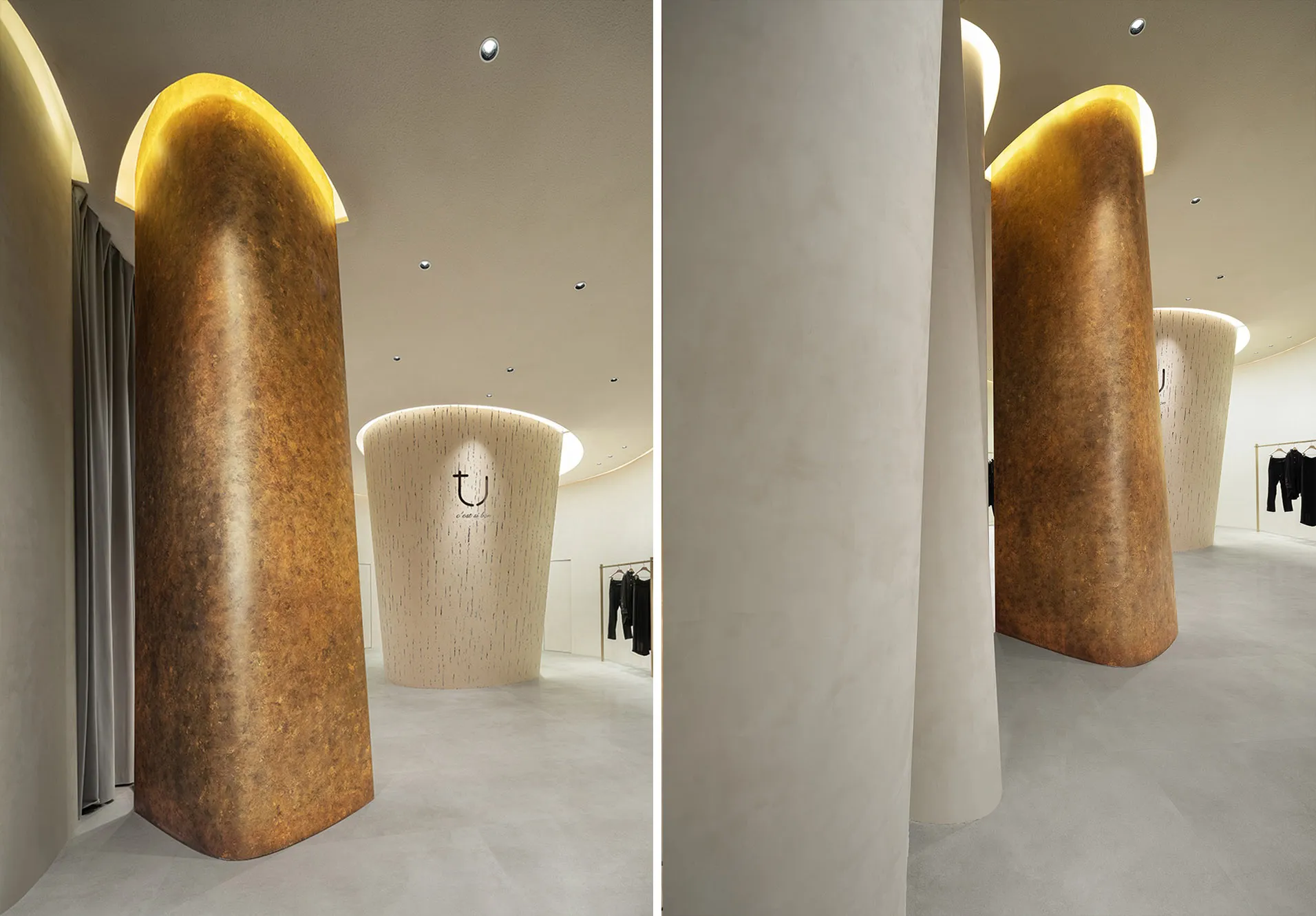 A modern retail storefront featuring a wall of curved wall-cladding adorned with concrete material and warm lighting to creat
