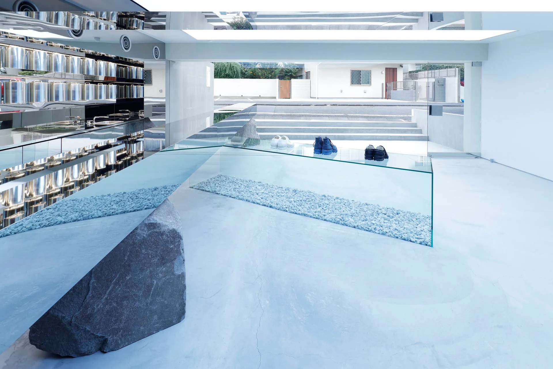 A minimalist storefront featuring glass elements.