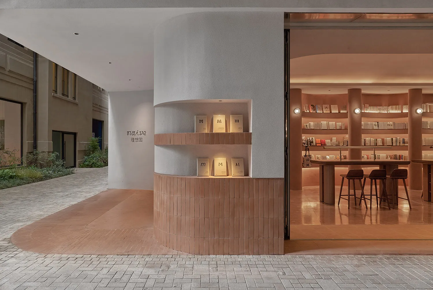 Modern bookstore interior with wooden shelves and seating