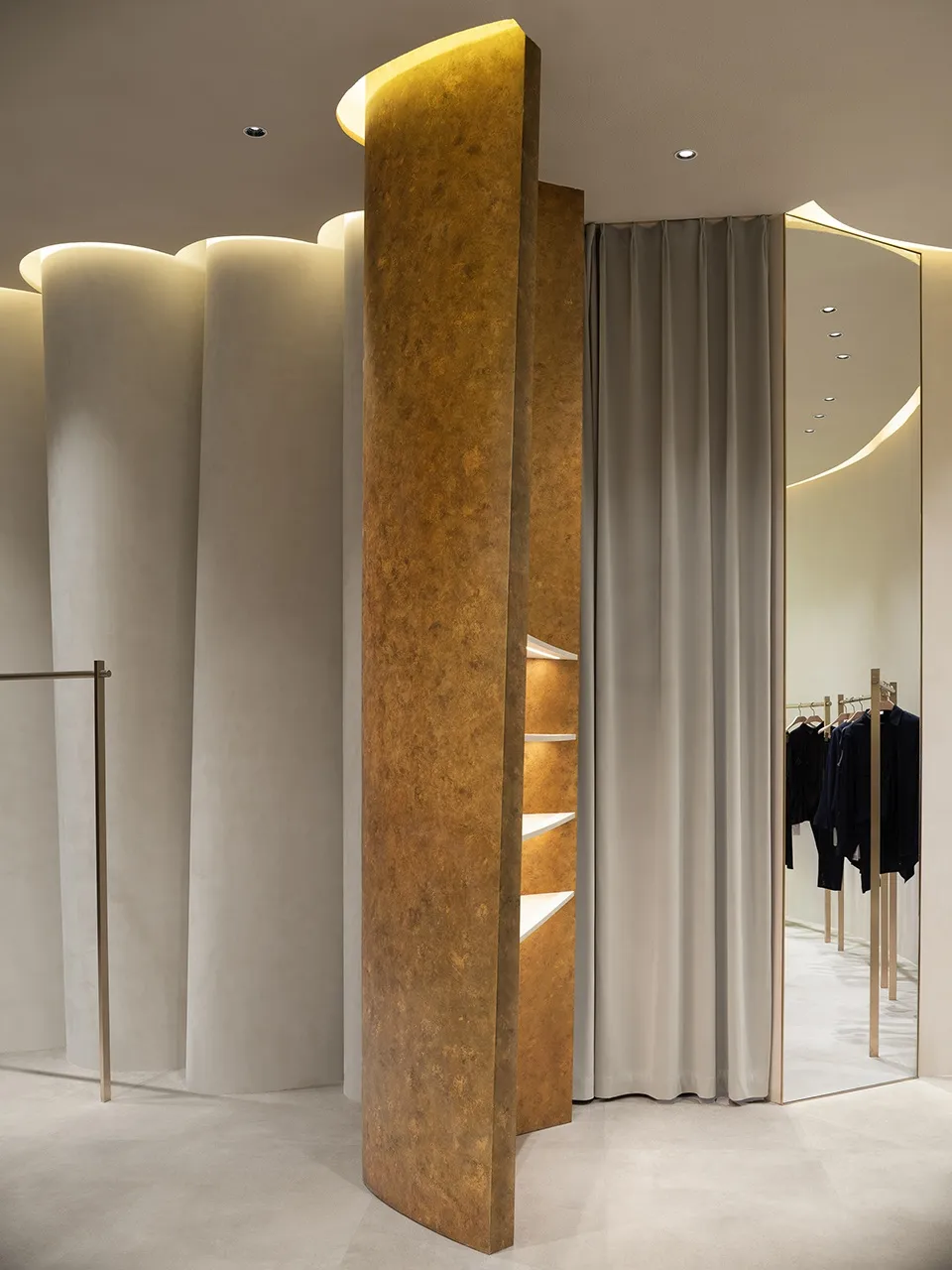 Modern, modular, metal-cladding design in a clothing retail store