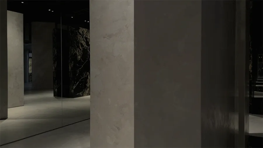 Modern industrial interior space featuring exposed concrete walls and floors.