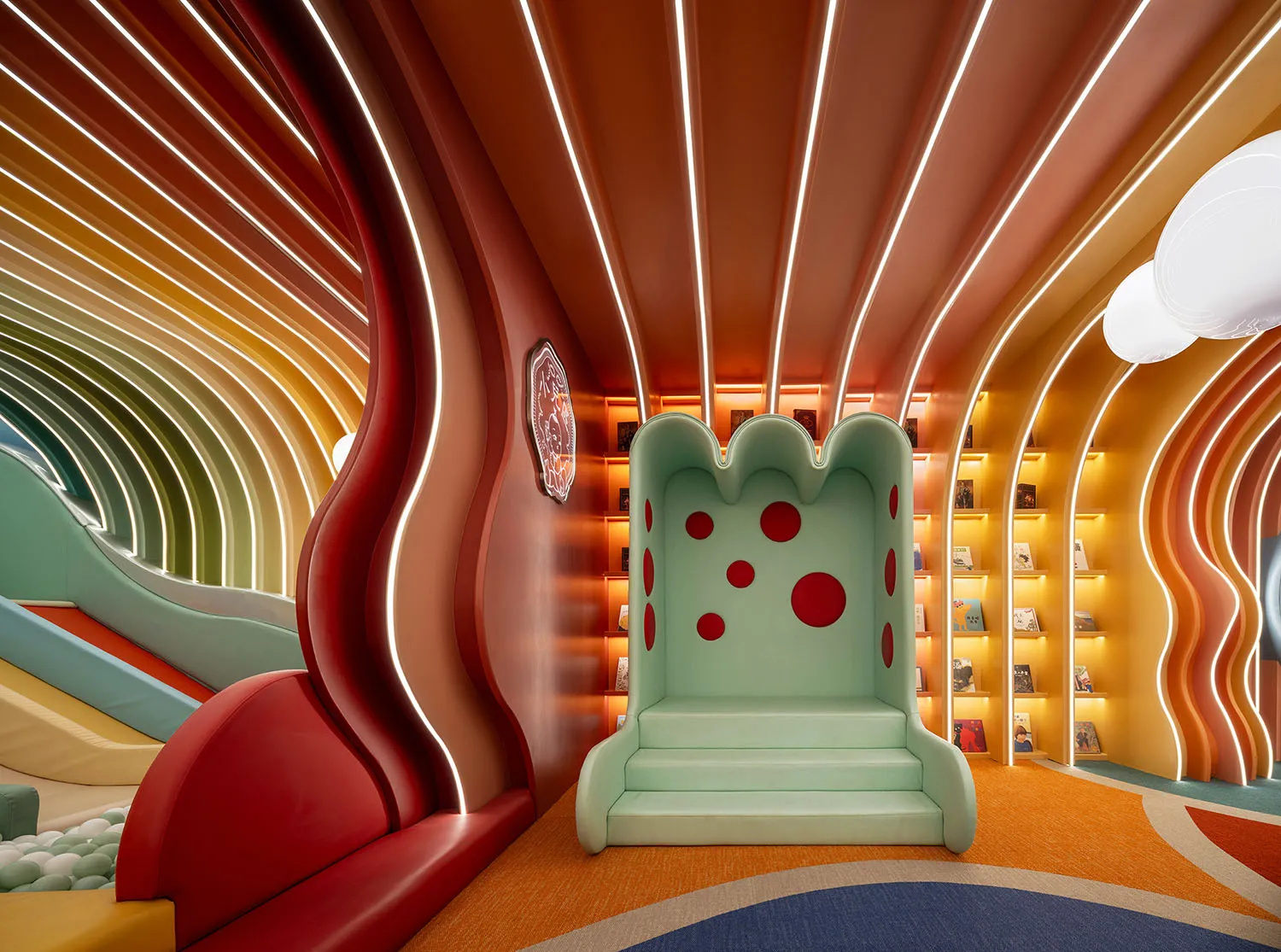 A modern playroom with a colorful plastic tunnel for children to climb and play.