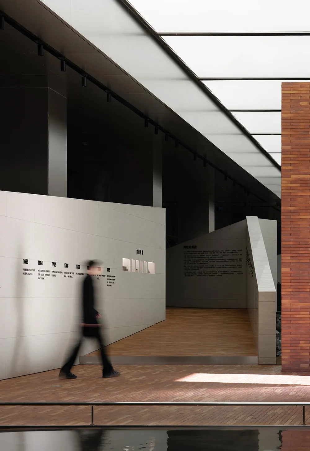 A minimalist interior design with concrete walls and flooring, featuring a sleek, contemporary aesthetic.
