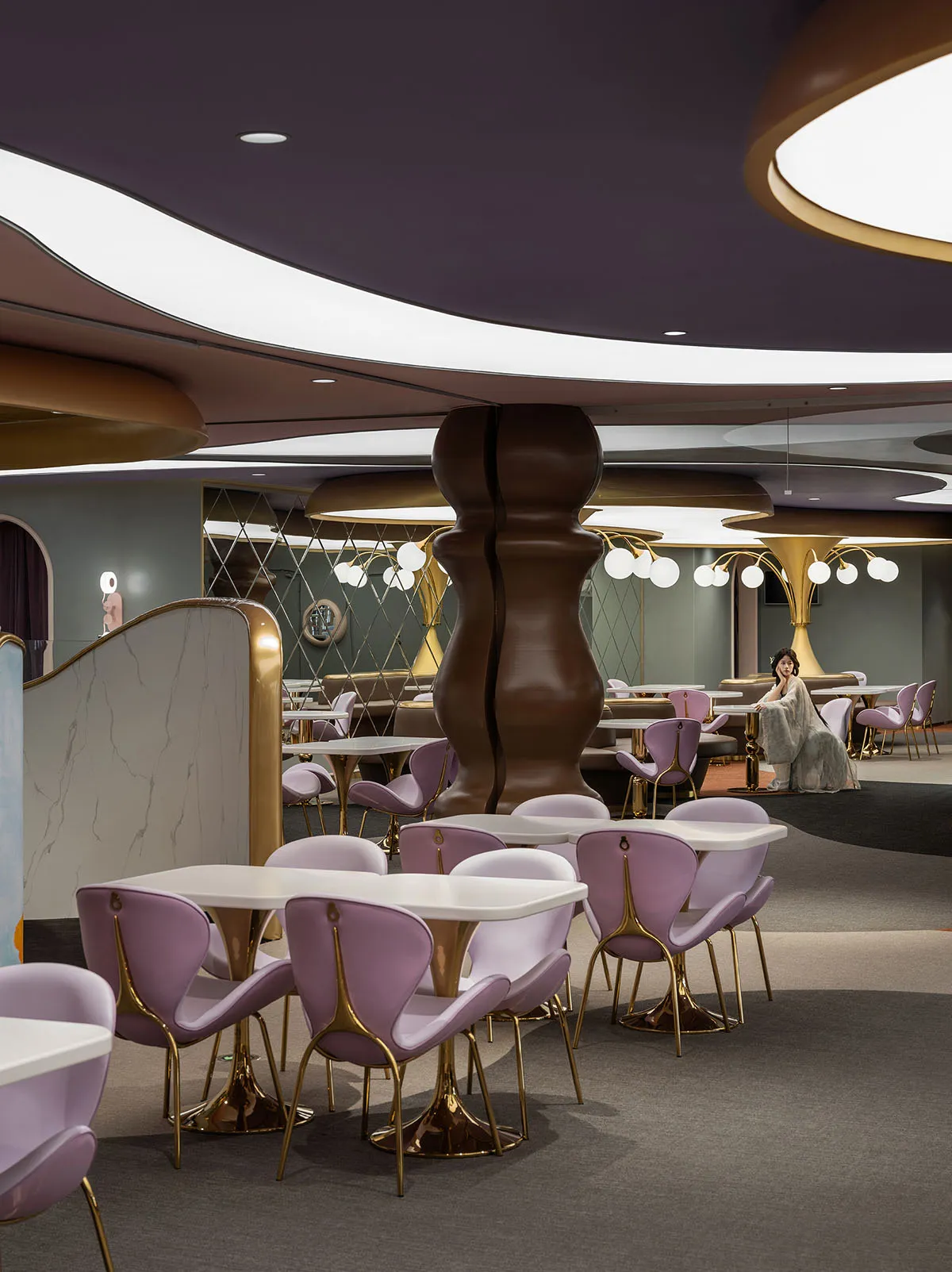 A modern restaurant with metallic furniture and walls.