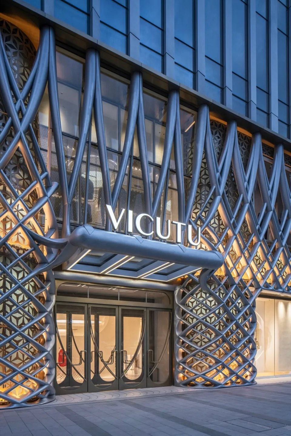 Modern retail storefront with metallic paneled cladding