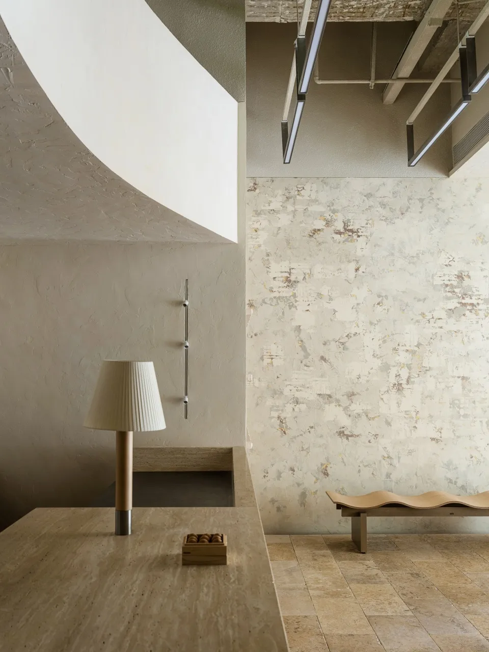 Modern interior space featuring concrete materials and minimalist design elements.