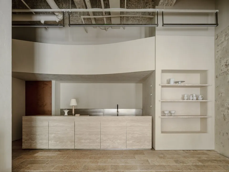 Modern concrete coffee bar with minimalist design elements.