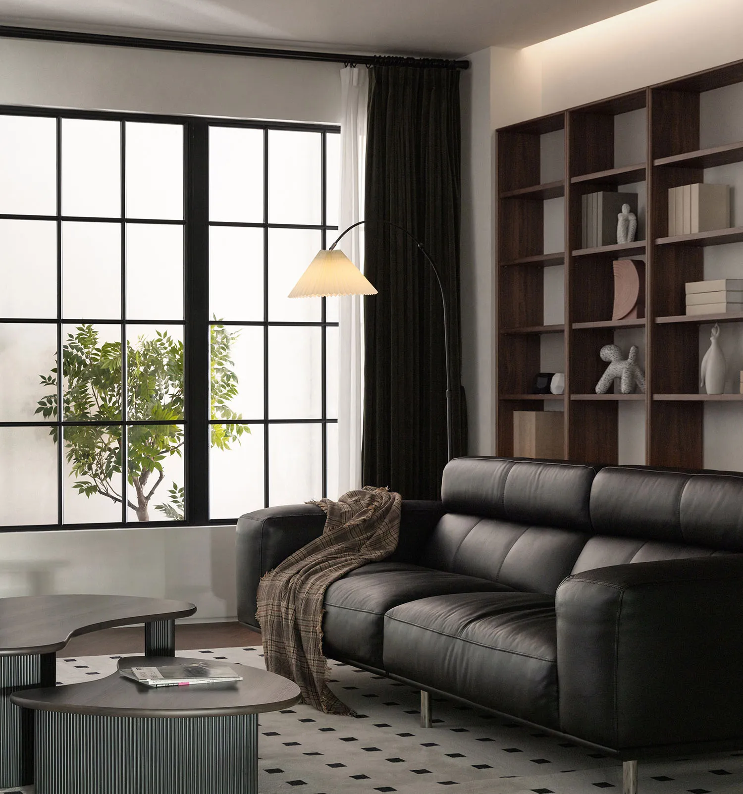 Modern living room with a black leather couch, wooden shelves, and a glass coffee table.