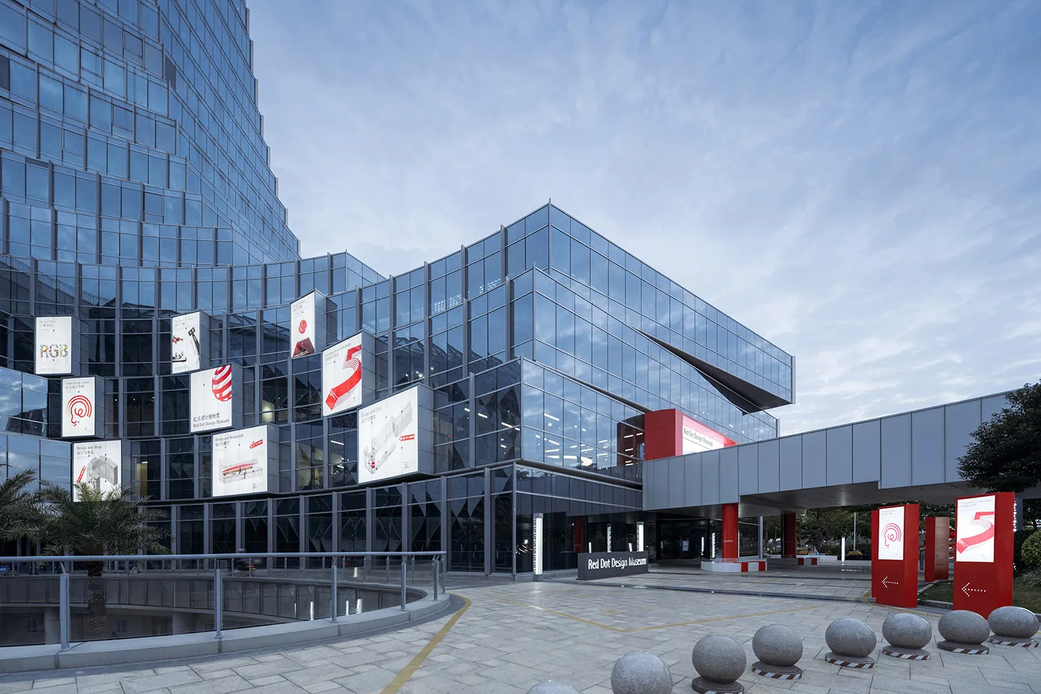 Modern minimalist design museum with glass exterior.