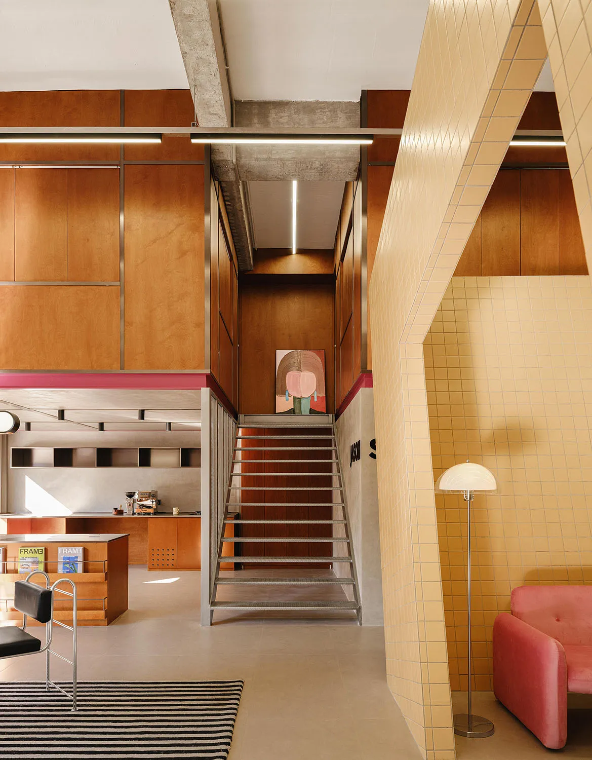 A minimalist community center featuring tiles and concrete counter.