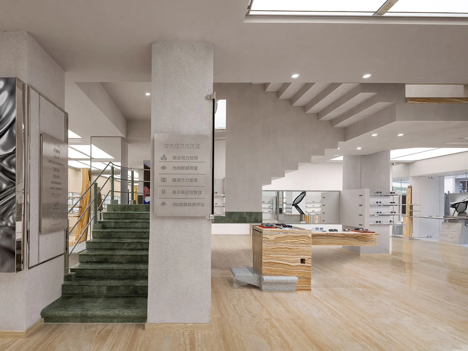 A modern showroom featuring marble and concrete furniture displays.