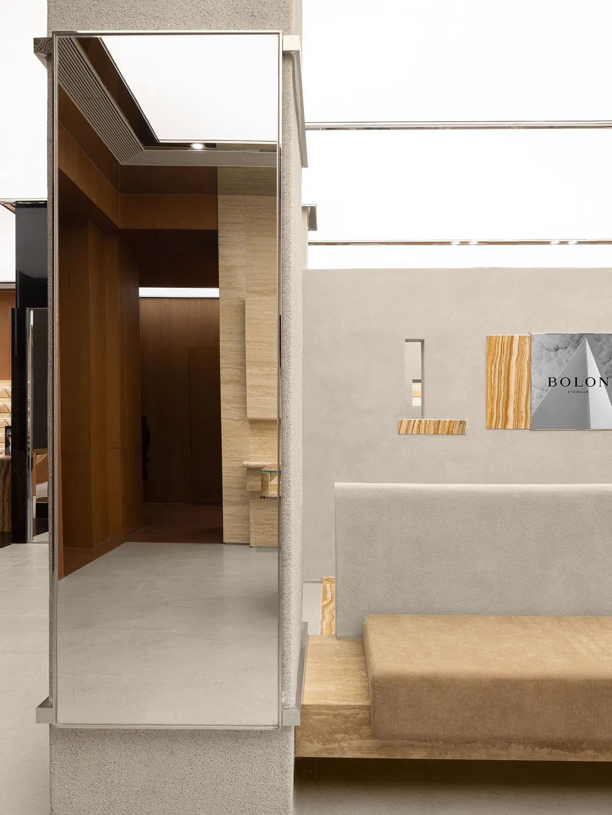 Modern retail storefront featuring concrete and marble materials