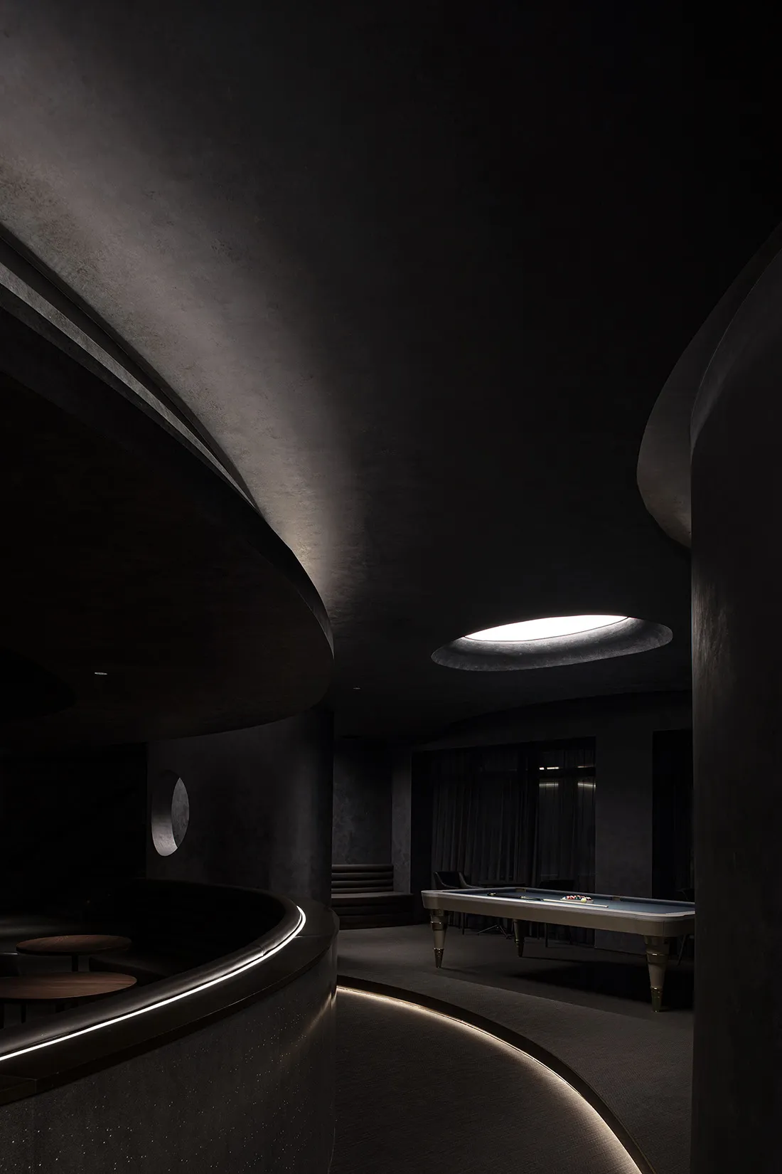 A modern interior space with concrete walls and minimalist design.